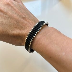 Links of London black and silver friendship bracelet.